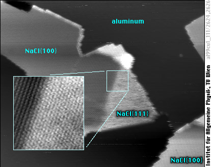 Single-layer NaCl(100) island with (111)-oriented rim